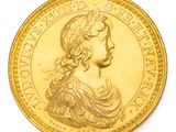 l'image d'une pièce d'or sur laquelle figure le portrait d'une femme