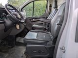 a white van with a black seat in the back of it