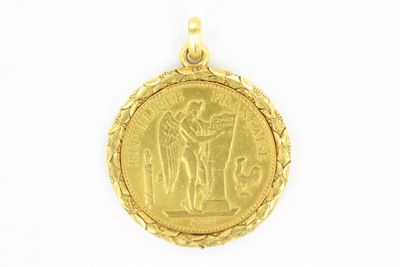 a close up of a gold coin on a white background