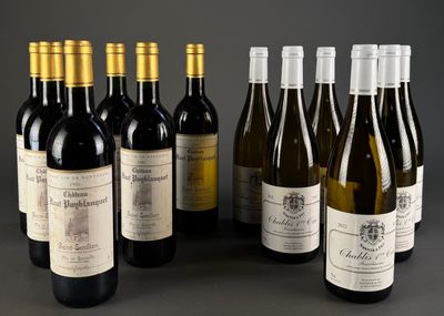 several bottles of wine are lined up on a table