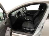 the interior of a car with the door open and the driver ' s seat down