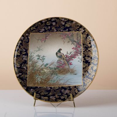 a plate with a picture of a bird on it
