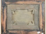 an old picture frame with a picture of a cat in it