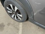 a close up of a car ' s tire on the pavement