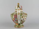 an oriental vase with a bird on the top and a bird on the bottom