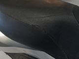 a close up of a motorcycle seat on a white surface