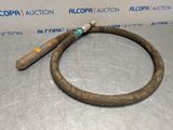 a close up of a hose on a table near a wall
