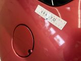 a sticker on the back of a red car