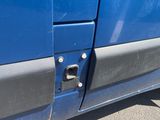 a close up of a blue car with a broken door