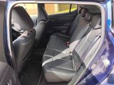 a blue car that is sitting in the back of the car