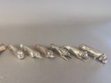 five birds that are sitting in a row on a table