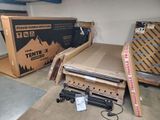 a pile of boxes and other items in a garage