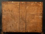 an old wooden chest with two doors open on a black background