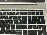 a close up of a laptop keyboard on a table