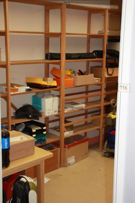 a room that has a lot of shelves and boxes on it
