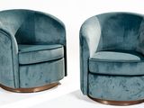 pair of mid century swivel chairs in blue velvet