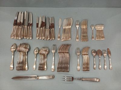 a lot of silverware on a table with a knife and fork