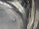a close up of a metal bowl with a metal lid