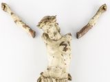 a small statue of a man holding a branch of a tree