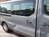 a silver van that is parked in a parking lot