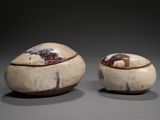 pair of white and brown bowls with lids sitting on a table