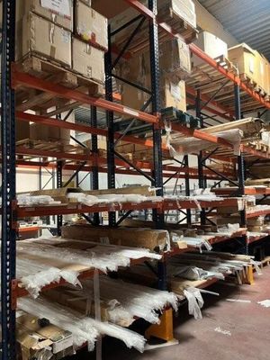 many shelves with boxes on them in a warehouse