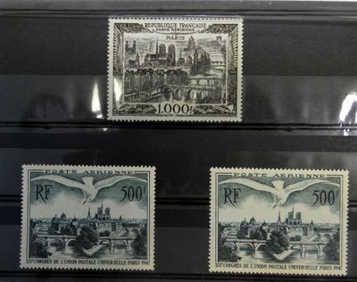 three stamps with a picture of a city and a bridge on them