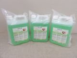 three bags of green liquid sitting next to each other on a table