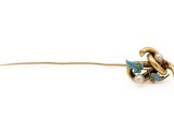 a close up of a gold and turquoise flower broochle