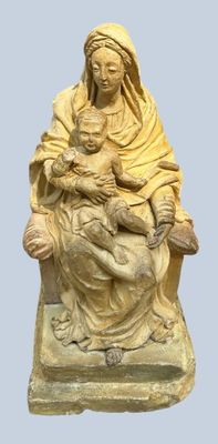 statue of a woman holding a baby in her arms
