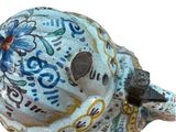 a blue and white skull with a flower on it