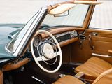 dashboard of a classic car with leather seats and a steering wheel