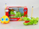 two toy dinosaurs that are sitting next to each other