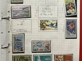 a notebook with a bunch of stamps on it