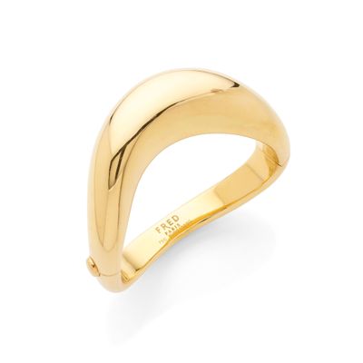 a gold plated ring with a curved design