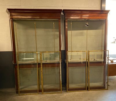 two glass display cases in the middle of a room