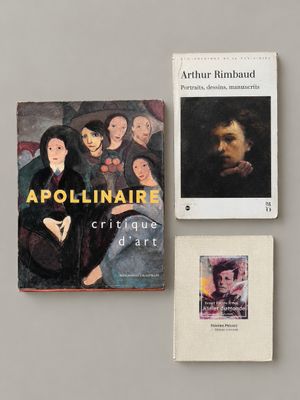 two books on a table with a picture of a man and a woman