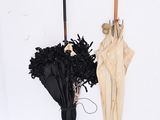 two umbrellas hanging on the wall next to each other