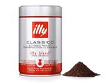 a close up of a tin of coffee with a cup of coffee in the background