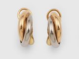 une paire de boucles d'oreilles créoles bicolores, en or et en argent