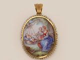 a gold and enamel pendant with a painting of a woman on a swing