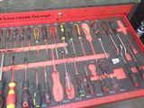 a red tool box with many different tools in it