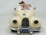 a toy car with a dog in the back of it