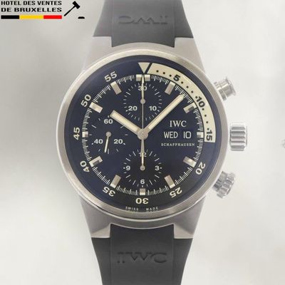 a black watch with a blue face on a white background