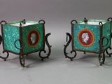 pair of green and red vases with a lady and a man on them