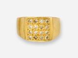 a close up of a gold ring with diamonds on a white background