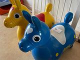 three plastic toy animals that are sitting on the floor