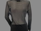 a mannequin mannequin wearing a black top and black pants