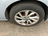 a close up of a car tire on the ground