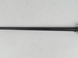 a black and gold pen sitting on top of a white table